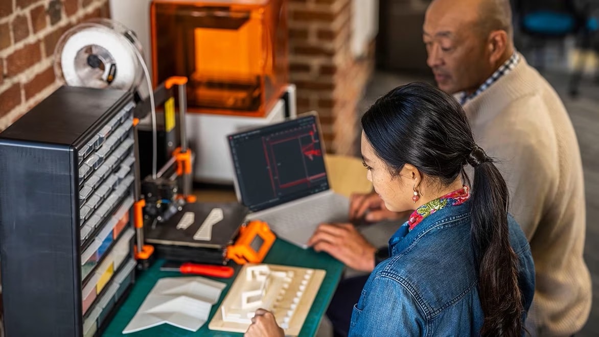 Two people working in AutoCAD mobile environment